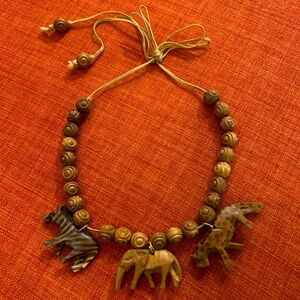 Carved wood animal motif necklace